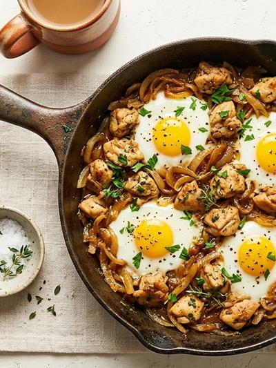 Lyonnaise Chicken and Caramelized Onion Breakfast Skillet with Soft Eggs